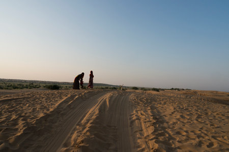 Car tyre marks on sand dunes of Thar desert, Rajasthan, India. Tourists arrive on cars to watch sun rise at desert , a very popular activity amongst travellers.の写真素材