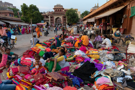 Jodhpur, Rajasthan, India - 20.10.2019 : Rajasthani womens clothes being sold at Famous Sardar Market and Ghanta ghar Clock tower in the evening.のeditorial素材