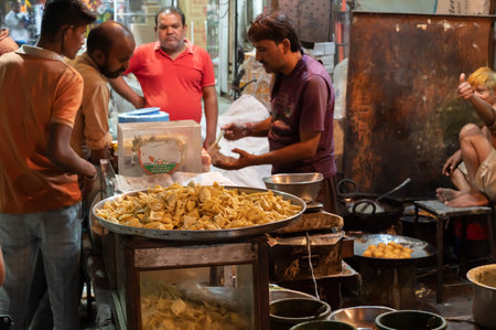 Jodhpur, Rajasthan, India - 19.10.2019 : Nimki, popular Indian street food is being sold at famous Sardar Market and Ghanta ghar Clock tower in Jodhpur, Rajasthan, India.のeditorial素材