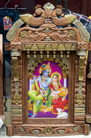Jodhpur, Rajasthan, India - 19.10.2019 : Beautiful framed art of Radha and Krishna, Hindu God, displayed for sale at famous Sardar Market and Ghanta ghar Clock tower in Jodhpur, Rajasthan, India.のeditorial素材