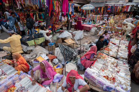 Jodhpur, Rajasthan, India - 20.10.2019 : White necklaces, gold plated earrings and ornaments are being sold to young female customers at famous Sardar Market and Ghanta ghar Clock tower in Jodhpur.のeditorial素材