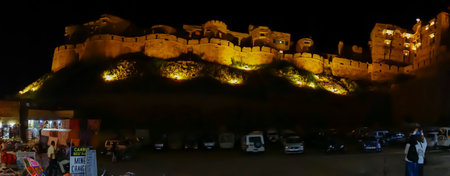 Jaisalmer,Rajasthan,India - October 14, 2019 : Night panoramic image of Jaisalmer Fort or Sonar Quila or Golden Fort. A "living fort"-made of yellow sandstone. UNESCO world heritage site, Car parking.のeditorial素材