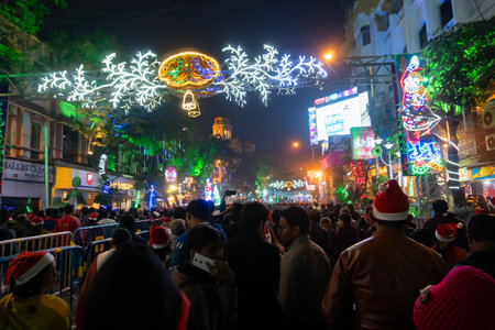 Kolkata, West Bengal, India - 26.12.2018 : Young people enjoying themselves at illuminated and decorated park street with lights with year end festive mood.のeditorial素材