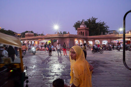 Jodhpur, Rajasthan, India - 19.10.2019 : Rajasthani woman at famous Sardar Market and Ghanta ghar Clock tower in Jodhpur, Rajasthan, India.のeditorial素材