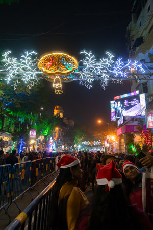 Kolkata, West Bengal, India - 26.12.2018 : Young people enjoying themselves at illuminated and decorated park street with lights with year end festive mood.のeditorial素材