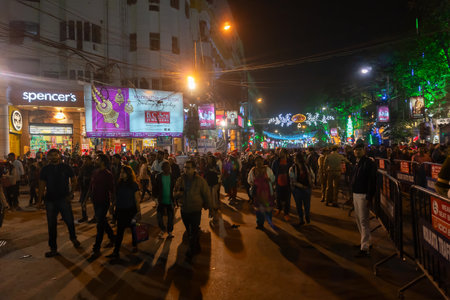 Kolkata, West Bengal, India - 26.12.2018 : Young people enjoying themselves at illuminated and decorated park street with lights with year end festive mood.のeditorial素材
