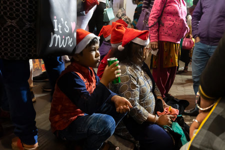 Kolkata, West Bengal, India - 26.12.2018 : Young people enjoying themselves at illuminated and decorated park street with lights with year end festive mood.のeditorial素材