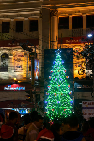 Kolkata, West Bengal, India - 26.12.2018 : Decorated Christmas tree, lights and Christmas celebration at illuminated Park street with joy and year end festive mood.のeditorial素材