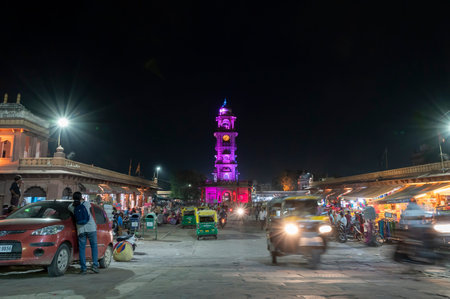 Jodhpur, Rajasthan, India - 18.10.2019 : Female photographer shooting famous Sardar Market and Ghanta ghar, Clock tower at night in Jodhpur, Rajasthan, India.のeditorial素材