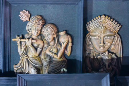Kolkata, West Bengal, India - 31st December 2018 : Lord Krishna playing flute and Radha smiling, Goddess Durga with Son Ganesh, decorative terracotta idols made in Krishnanagar, Nadia, West Bengal,のeditorial素材