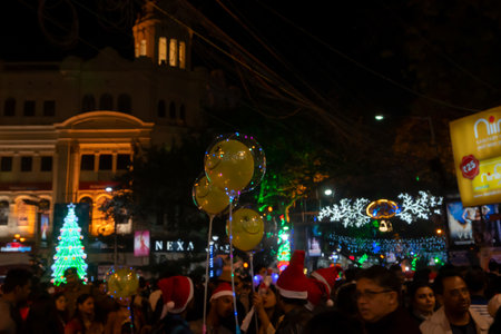 Kolkata, West Bengal, India - 25.12.2018 : Decorated balloons, lights and Christmas celebration at illuminated Park street with joy and year end festive mood. Dark sky background.のeditorial素材