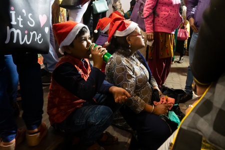 Kolkata, West Bengal, India - 26.12.2018 : Young people enjoying themselves at illuminated and decorated park street with lights with year end festive mood.のeditorial素材