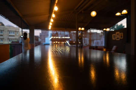 Beautiful interior view of restaurant at Jodhpur, Rajasthan, India. Reflection of decorated lights on shining table top.の写真素材