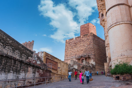 Jodhpur, Rajasthan, India - 19th October 2019 : Indian tourists in modern dress visiting famous old Mehrangarh fort. Fort is UNESCO world heritage site popular amongst tourists worldwide.のeditorial素材