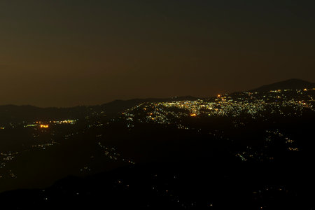 Pearls of light of Queen of Hills, Darjeeling town, at night. In the Eastern Himalayas, To the west of Darjeeling lies Nepal, to the east the Kingdom of Bhutan, to the north Sikkim.West Bengal, India.の写真素材