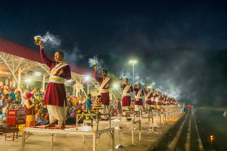Tribeni Ghat, Rishikesh, Uttarakhand - 29th October 2018 : Ganga aarti being performed by Hindu priests to the chants of Vedic hymns. Crowded , biggest, most famous ghat at the banks of river Ganges.のeditorial素材