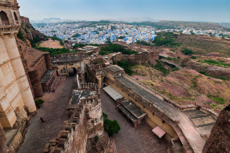 Jodhpur, Rajasthan, India - 19.10.2019 : Top view of Mehrangarh fort with distant view of blue city of Jodhpur. Blue sky in the background. Historical Fort is UNESCO world heritage site.のeditorial素材