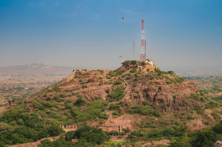 View of Jodhpur city mobile tower beside Mehrangarh fort, jodhpur, Rajasthan, India. Blue sky in the background. History meets modern technology here.のeditorial素材