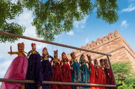 Traditional King and queen, called Raja Rani, handmade puppets or Katputli Sets are hanging for sale inside Meharangarh fort, Jodhpur, Rajasthan, India. Dolls in Jodhpur popular and sold to tourists.のeditorial素材