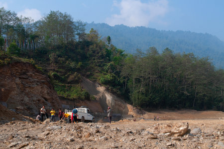High altitude playground and stadium is being made by cutting tree and levelling Himalayan soil, Environmental damage to Himalayan mountains casuing natural disaster in mountains, Sikkim, India.の写真素材