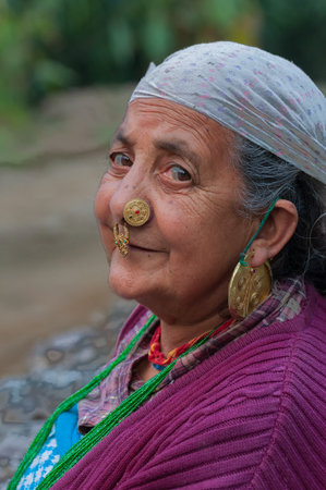 Sikkim, India - 23rd March 2004 : Senior citizen Sikkimese woman with thoughtful face. Sikkimese women are very hard working and they age very gracefully.のeditorial素材