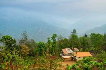 Beautiful morning in mountains of Himalayas, Hee Barmiok village of Sikkim, India. Wooden houses in the middle of scenic view of Sikkim.の写真素材