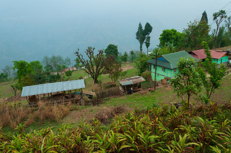 Beautiful morning in mountains of Himalayas, Hee Barmiok village of Sikkim, India. Wooden houses in the middle of scenic view of Sikkim.の写真素材