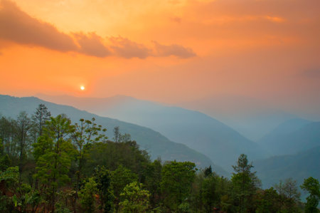 Beautiful sunrise in mountains of Himalayas, Hee Barmiok village of Sikkim, India. Great Himalayan mountain peaks in the background.の写真素材