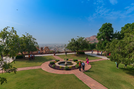 Jodhpur, Rajasthan, India - 20.10.2019 : Visitors enjoying beautiful decorated garden of Jaswant Thada cenotaph. Garden has carved gazebos, a tiered garden, and a small lake with nice view.のeditorial素材