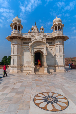 Jodhpur, Rajasthan, India - 20.10.2019 : Visitors enoying beautiful architecture of Jaswant Thada cenotaph. Makrana marble emitting warm glow when illuminated by the Sun. Blue sky background.のeditorial素材