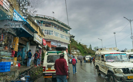 Pauri, Garhwal, Uttrakhand, India - 3rd November 2018 : Monsoon on the streets of Pauri. Rainy street image of busy town on the mountains of Himalayas. Climate change effect on Himalayas.のeditorial素材