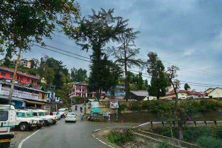 Pauri, Garhwal, Uttrakhand, India - 3rd November 2018 : Monsoon on the streets of Pauri. Rainy street image of busy town on the mountains of Himalayas. Climate change effect on Himalayas.のeditorial素材