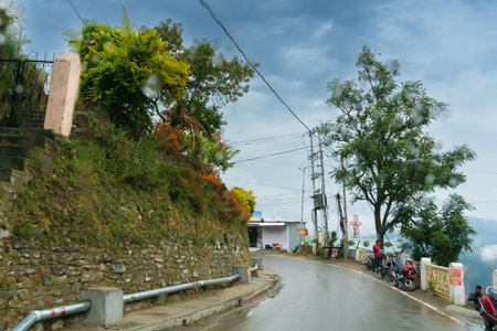 Pauri, Garhwal, Uttrakhand, India - 3rd November 2018 : Monsoon on the streets of Pauri. Rainy street image of busy town on the mountains of Himalayas. Climate change effect on Himalayas.のeditorial素材