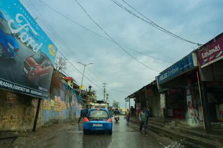 Pauri, Garhwal, Uttrakhand, India - 3rd November 2018 : Monsoon on the streets of Pauri. Rainy street image of busy town on the mountains of Himalayas. Climate change, cloudy sky of Himalayas.のeditorial素材