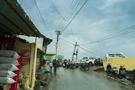 Pauri, Garhwal, Uttrakhand, India - 3rd November 2018 : Monsoon on the streets of Pauri. Rainy street image of busy town on the mountains of Himalayas. Climate change, cloudy sky of Himalayas.のeditorial素材