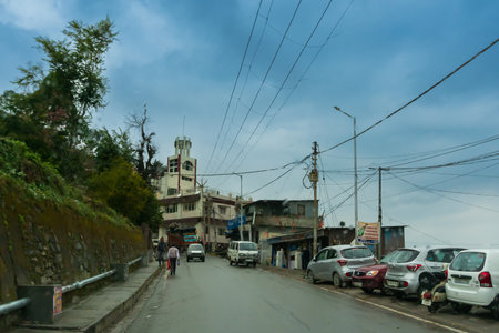 Pauri, Garhwal, Uttrakhand, India - 3rd November 2018 : Monsoon on the streets of Pauri. Rainy street image of busy town on the mountains of Himalayas. Climate change, cloudy sky of Himalayas.のeditorial素材