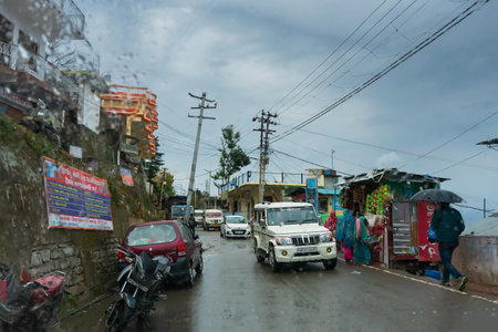 Pauri, Garhwal, Uttrakhand, India - 3rd November 2018 : Monsoon on the streets of Pauri. Rainy street image of busy town on the mountains of Himalayas. Climate change, cloudy sky of Himalayas.のeditorial素材