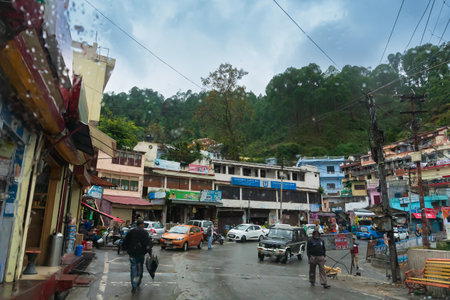 Pauri, Garhwal, Uttrakhand, India - 3rd November 2018 : Monsoon on the streets of Pauri. Rainy street image of busy town on the mountains of Himalayas. Climate change effect on Himalayas.のeditorial素材