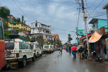 Pauri, Garhwal, Uttrakhand, India - 3rd November 2018 : Monsoon on the streets of Pauri. Rainy street image of busy town on the mountains of Himalayas. Climate change, cloudy sky of Himalayas.のeditorial素材