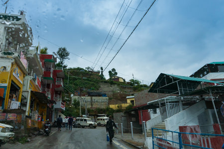 Pauri, Garhwal, Uttrakhand, India - 3rd November 2018 : Monsoon on the streets of Pauri. Rainy street image of busy town on the mountains of Himalayas. Climate change, cloudy sky of Himalayas.のeditorial素材