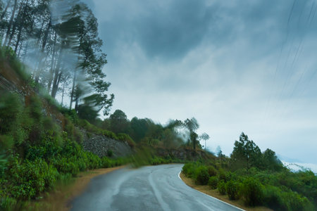 Monsoon on the hills, Himalayan mountains, Garhwal, Uttarakhand, India. Rainy image of the mountains of Himalayas. Climate change effect on Himalayas. Shot through glass.の写真素材