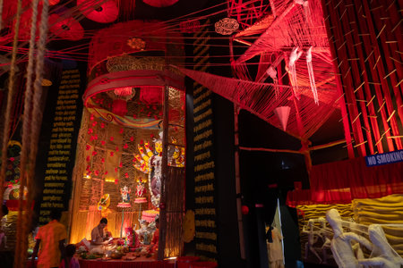 Howrah, West Bengal, India- 3rd October, 2022 : Beautifully decorated Durga idol is being worshipped inside puja pandal. Durga Puja is biggest festival of Hinduism, celebrated all over the world.のeditorial素材