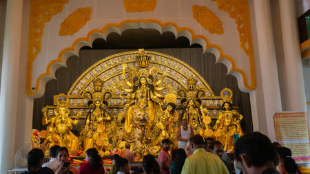 Howrah, West Bengal, India- 4th October, 2022 : Decorated Durga idol is being worshipped inside illuminated puja pandal. Mandirtala sadharon durgotsab. Durga Puja is biggest festival of Hinduism.のeditorial素材