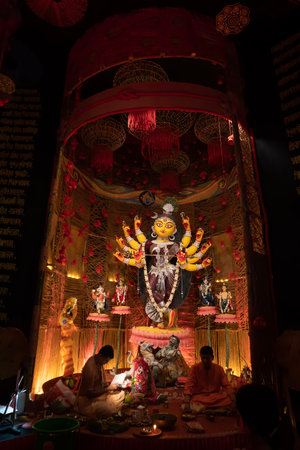 Howrah, West Bengal, India- 3rd October, 2022 : Beautifully decorated Durga idol is being worshipped inside puja pandal. Durga Puja is biggest festival of Hinduism, celebrated all over the world.のeditorial素材