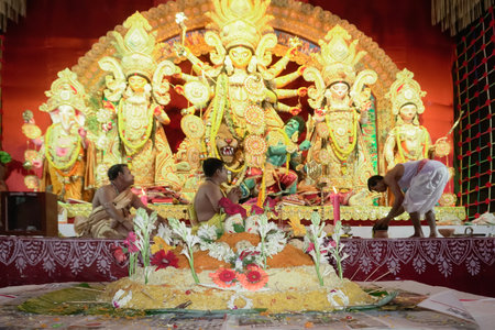 Howrah, West Bengal, India - 5th October, 2022 : Vog,decorated Holy food being offered to Goddess Durga, Hindu purohits arranging for puja in background.Durga Puja ritual.Biggest festival of Hinduism.のeditorial素材