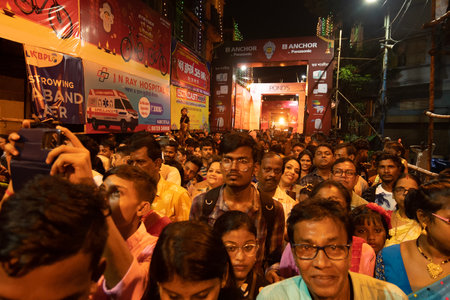 Kolkata, West Bengal, India- 4h October, 2022 : Hindu devotees gathered on decorated and illuminated street during Durga puja festival night to visit pandal.Durga puja is biggest festival of Hindusim.のeditorial素材