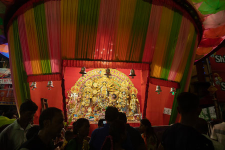 Kolkata, West Bengal, India- 4th October, 2022 : Devotees visiting illuminated and decorated Durga Puja pandal. Durga Puja is biggest festival of Hinduism. It is Unesco intangible cultural heritage.のeditorial素材