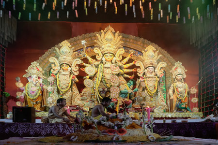 Howrah, West Bengal, India - 5th October, 2022 : Vog,decorated Holy food being offered to Goddess Durga, Hindu purohits arranging for puja in background.Durga Puja ritual.Biggest festival of Hinduism.のeditorial素材
