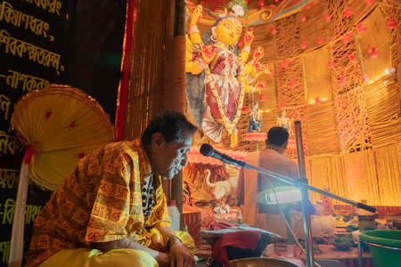 Howrah, West Bengal, India- 3rd October, 2022 : Holy Hindu Shlokas from Bhagavad Gita is being uttererd for hearing of all devotees inside Durga puja pandal.Durga Puja is biggest festival of Hinduism.のeditorial素材