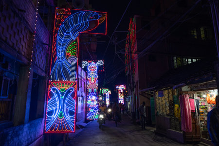 Howrah, West Bengal, India- 3rd October, 2022 : Decorated and illuminated street during Durga puja festival night. Durga puja is biggest festival of Hindusim.のeditorial素材